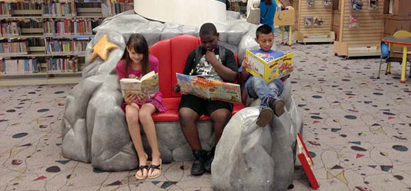 kids reading in kids library