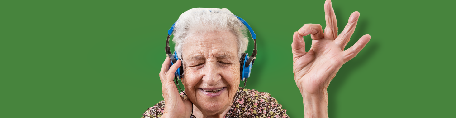 old woman listening to headphones