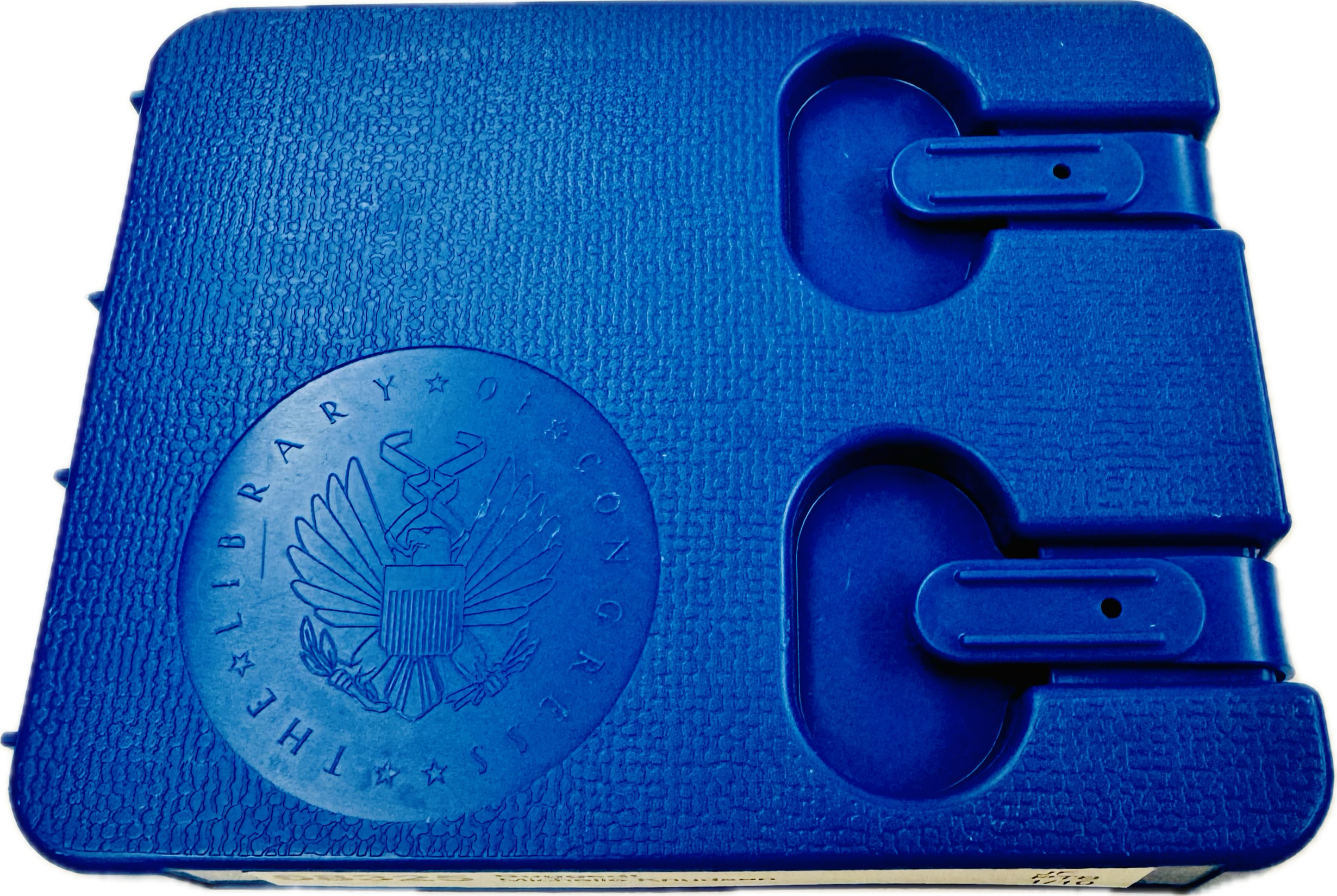 blue textured case for talking books cartidge printed with seal of the Library of Congress