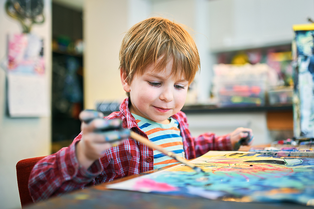 preschool boy painting