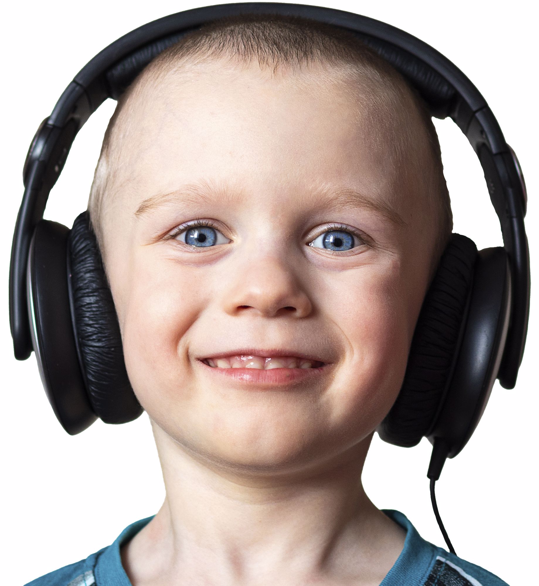 Happy child with headphones listening to music.