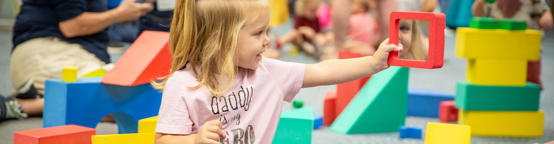 girl playing with blocks