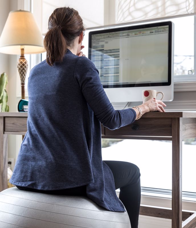Woman Working From Home facing window