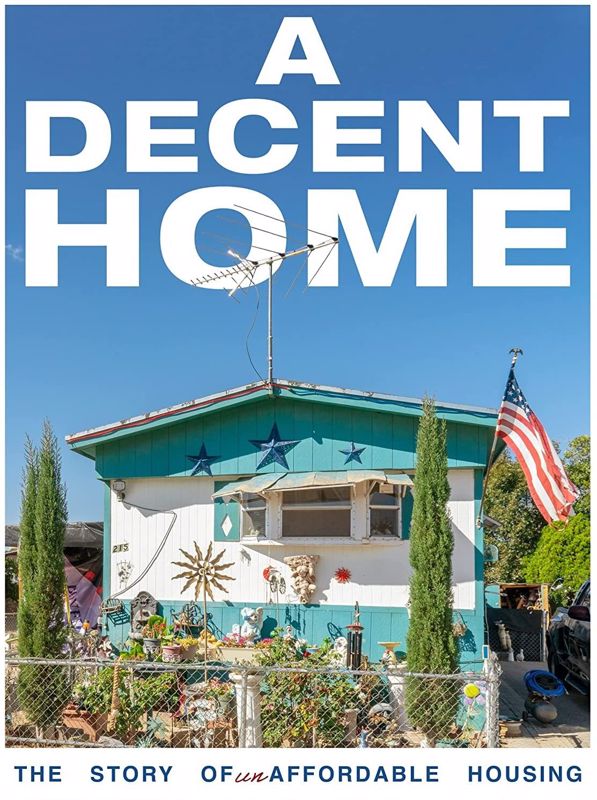 image of turquoise and white mobile home with an American flag
