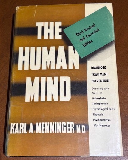 Color photo of a copy of Dr. Carl Menningers book 