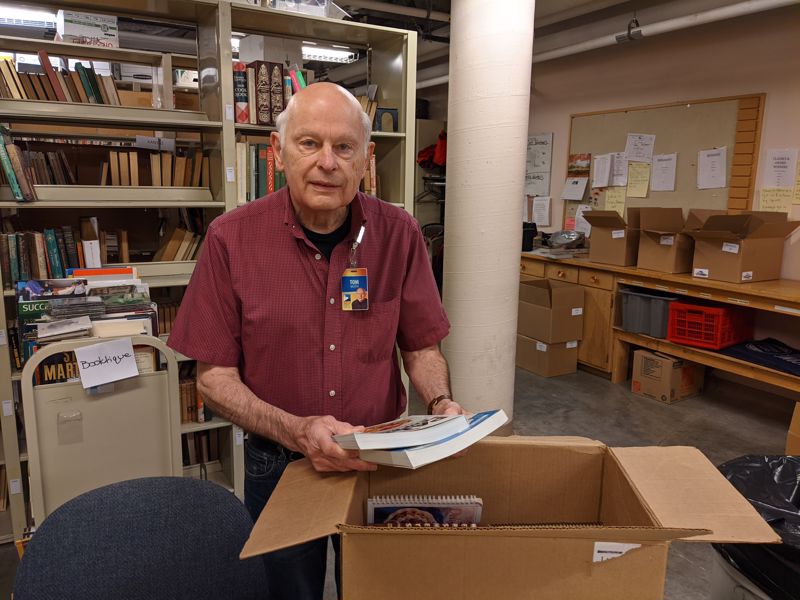 Tom Muth sorting books