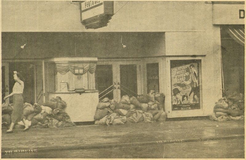 An image taken from a special edition of the Topeka Daily Capital showing sandbags piled up in front of a North Topeka theater
