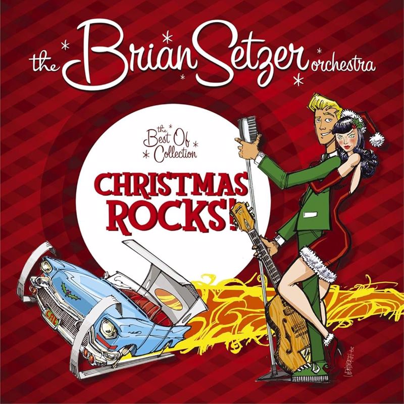 Brian Setzer with microphone and guitar, a lady in a santa outfit, and a convertible blue Cadillac hot rod