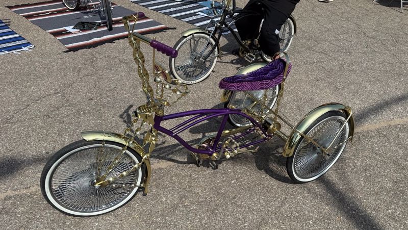 photo of a purple and gold lowrider trike