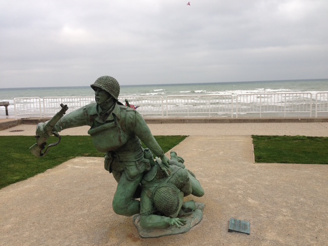 Color photograph showing the 29th Infantry memorial on Omaha beach in Normandy, France