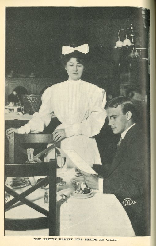 A black and white photo of a male diner at a Harvey House restaurant with a Harvey Girl standing by to take his order. Photo is captioned 