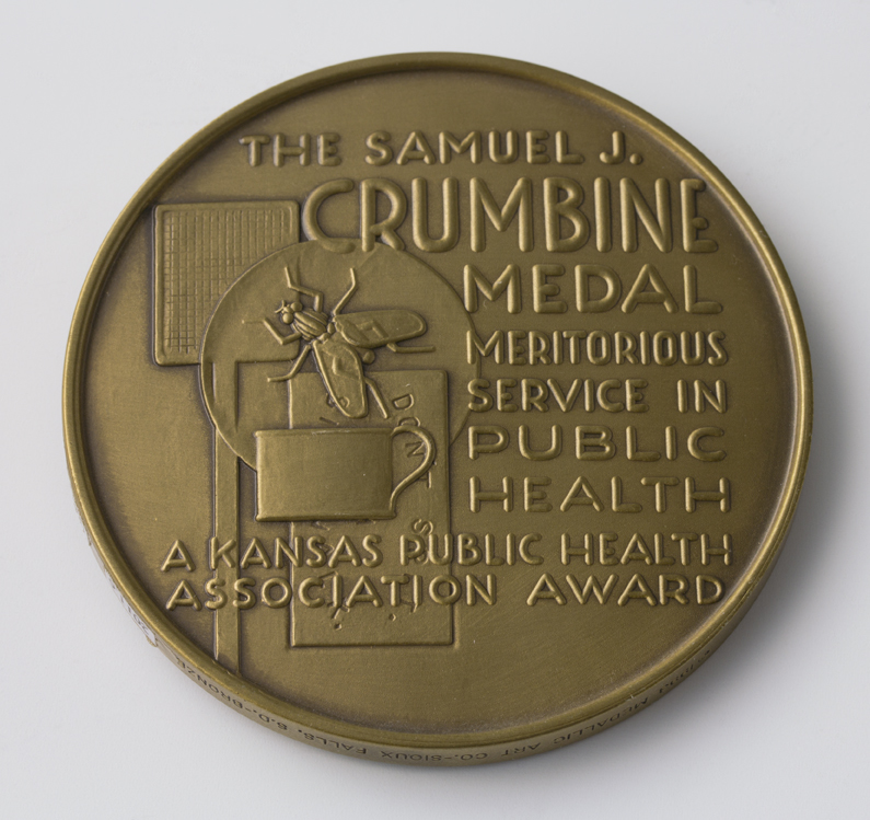 A color image of the back of the Samuel J. Crumbine medal awarded to Dr. Robert C. Harder