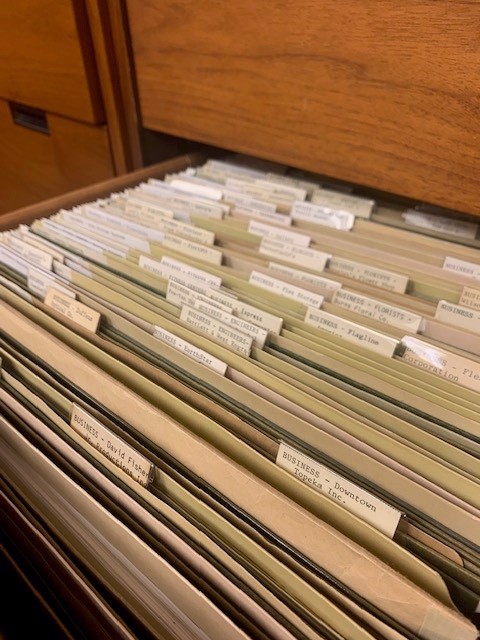 A close-up view of the hanging file folders in the Topeka Room vertical files.