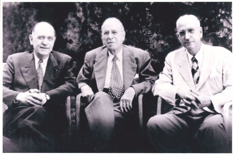 A black and white image of brothers Dr. William, Edwin, and Dr. Karl Menninger, all seated