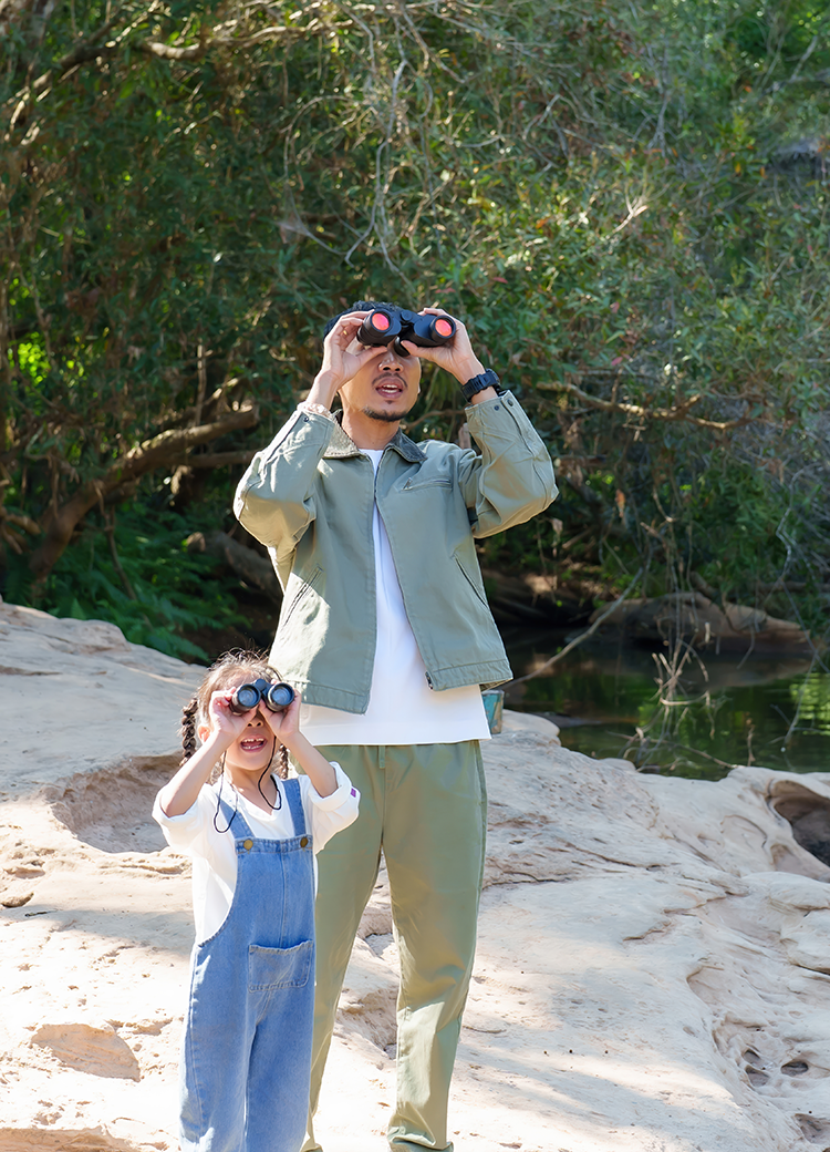 father and daughter bird watching