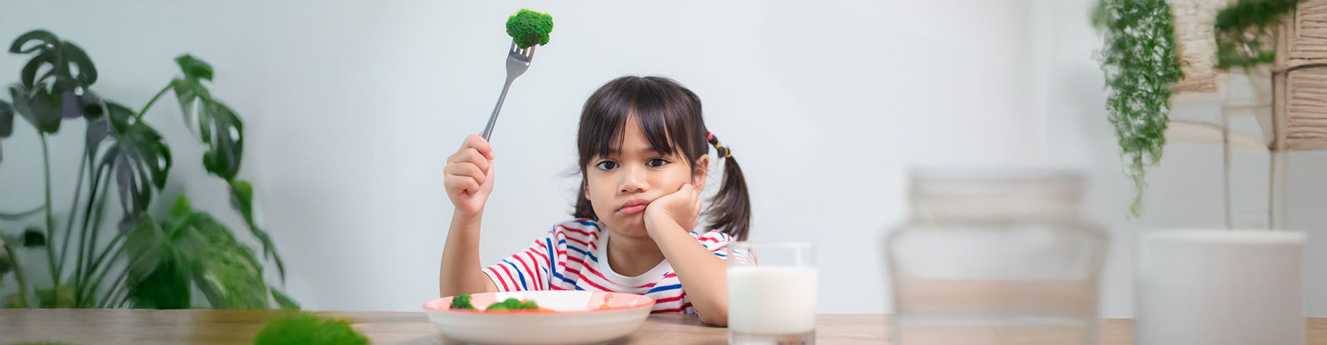 kid frowning at food