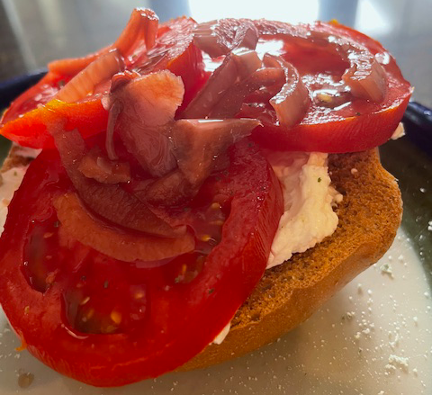 tomatoes cheese and onions on bagel