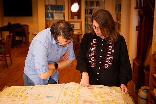 man and woman looking at map