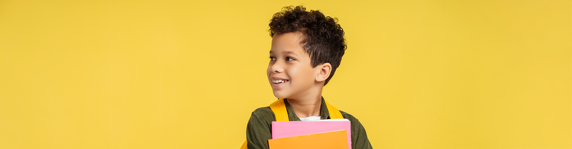 boy with books and backpack