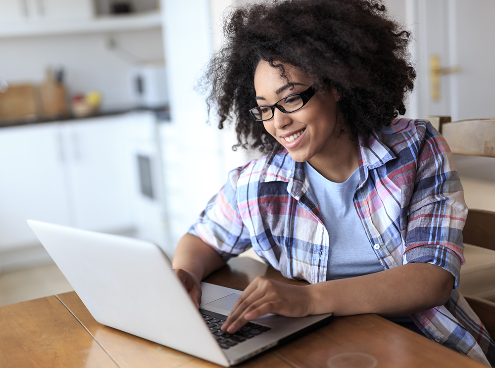 happy woman on laptop