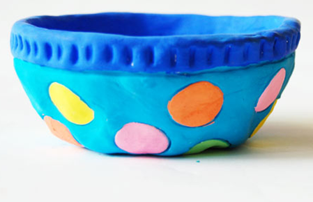 Painted pinch pot with acrylic paint.