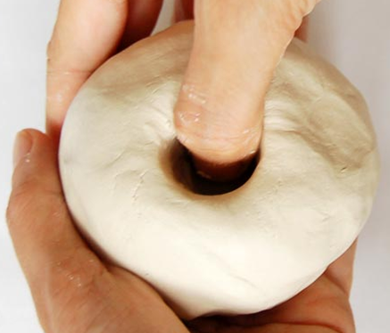 Start pressing into clay to make initial opening.