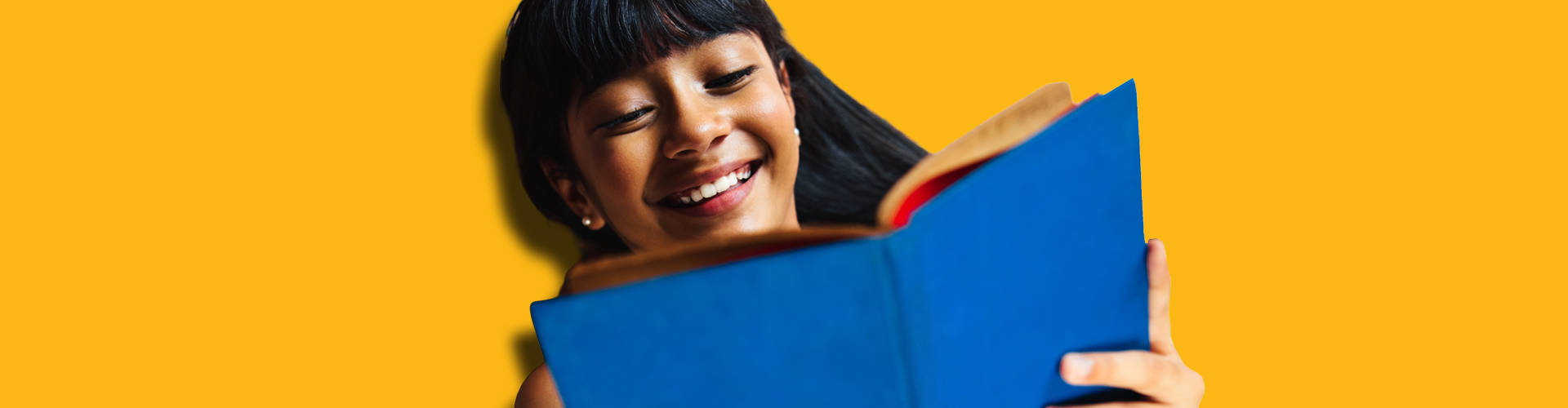 laughing teen reading