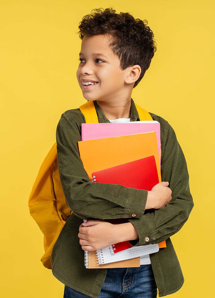 boy with books and backpack