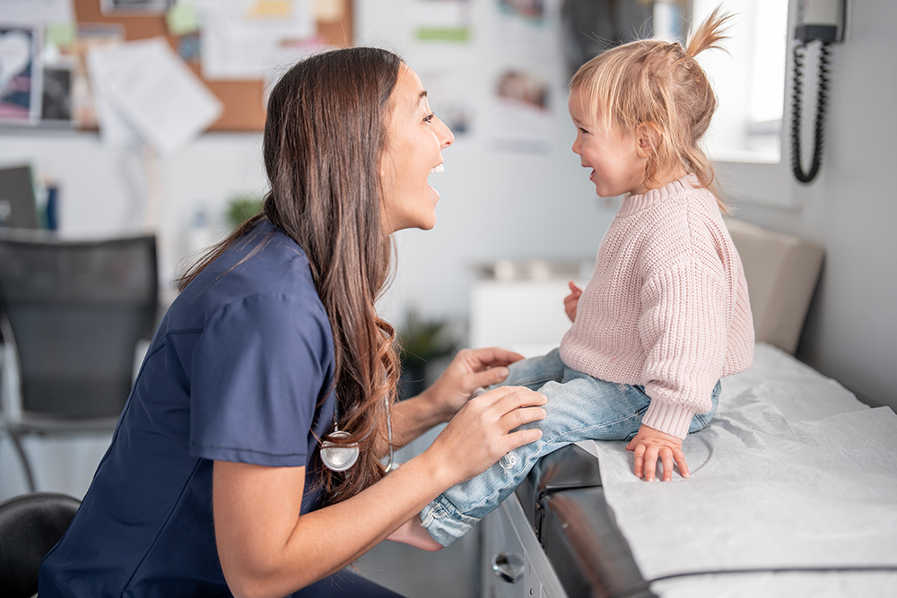 doctor and child laughing