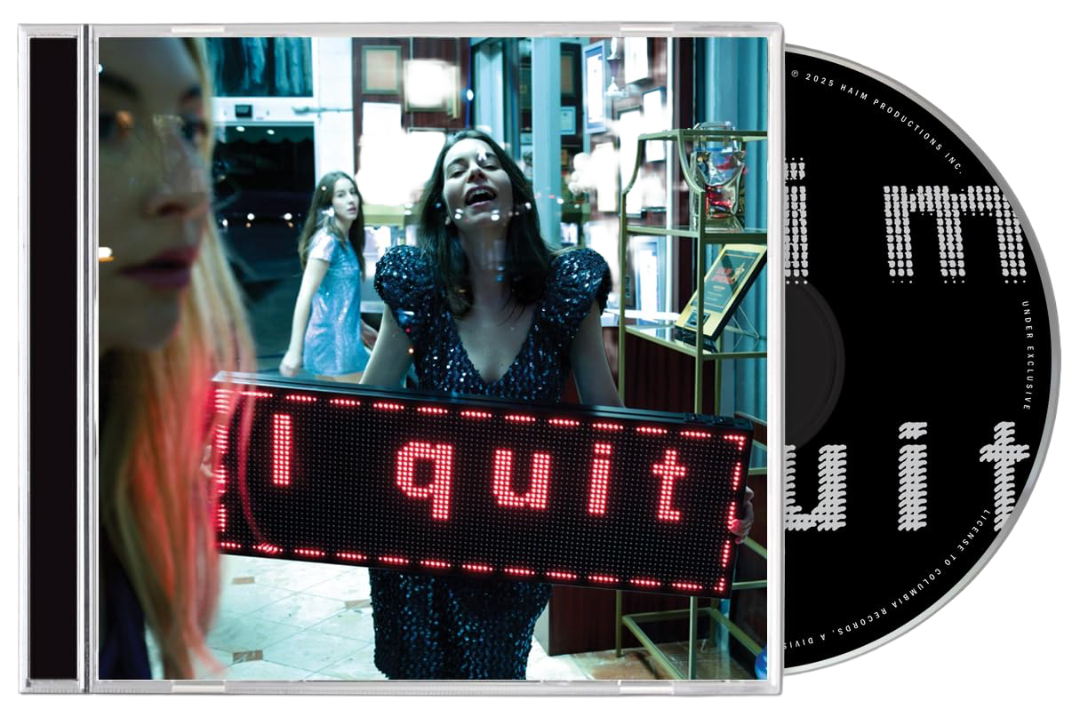 CD and case woman holding I quit sign