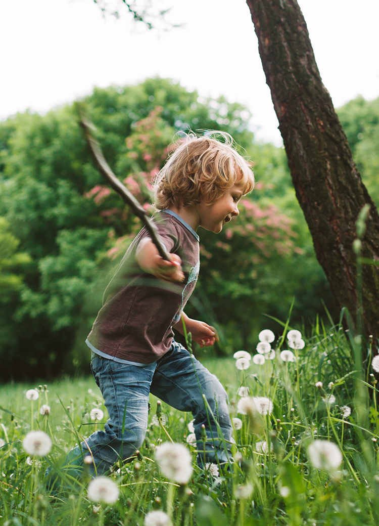 boy playing in field