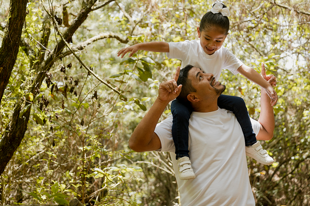 dad and daughter walking in nature