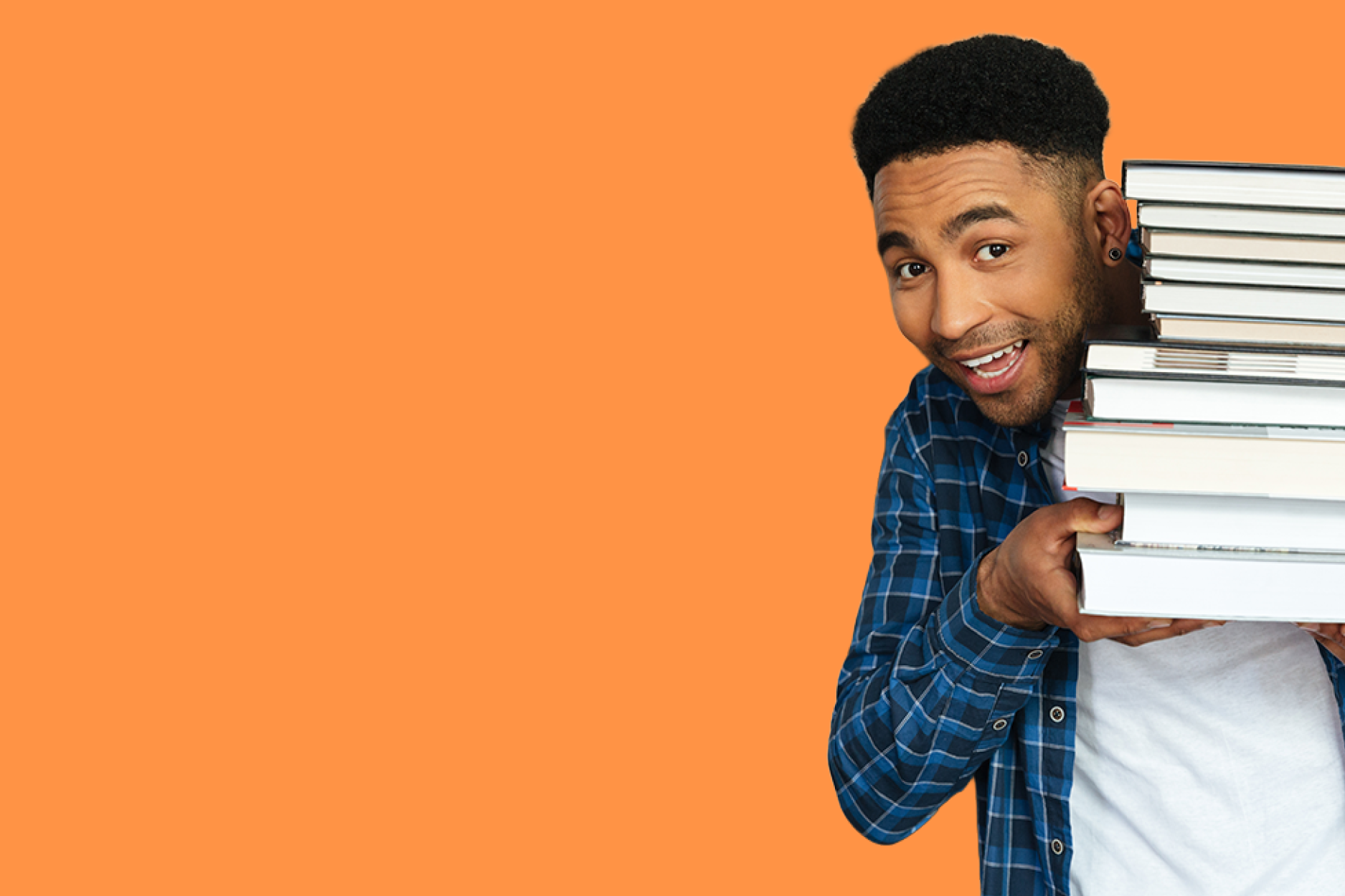 man with stack of books