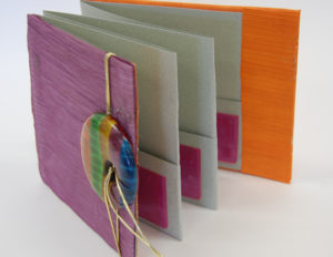 Accordion book with pockets
