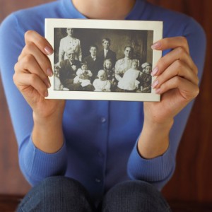 Woman holding old photograph