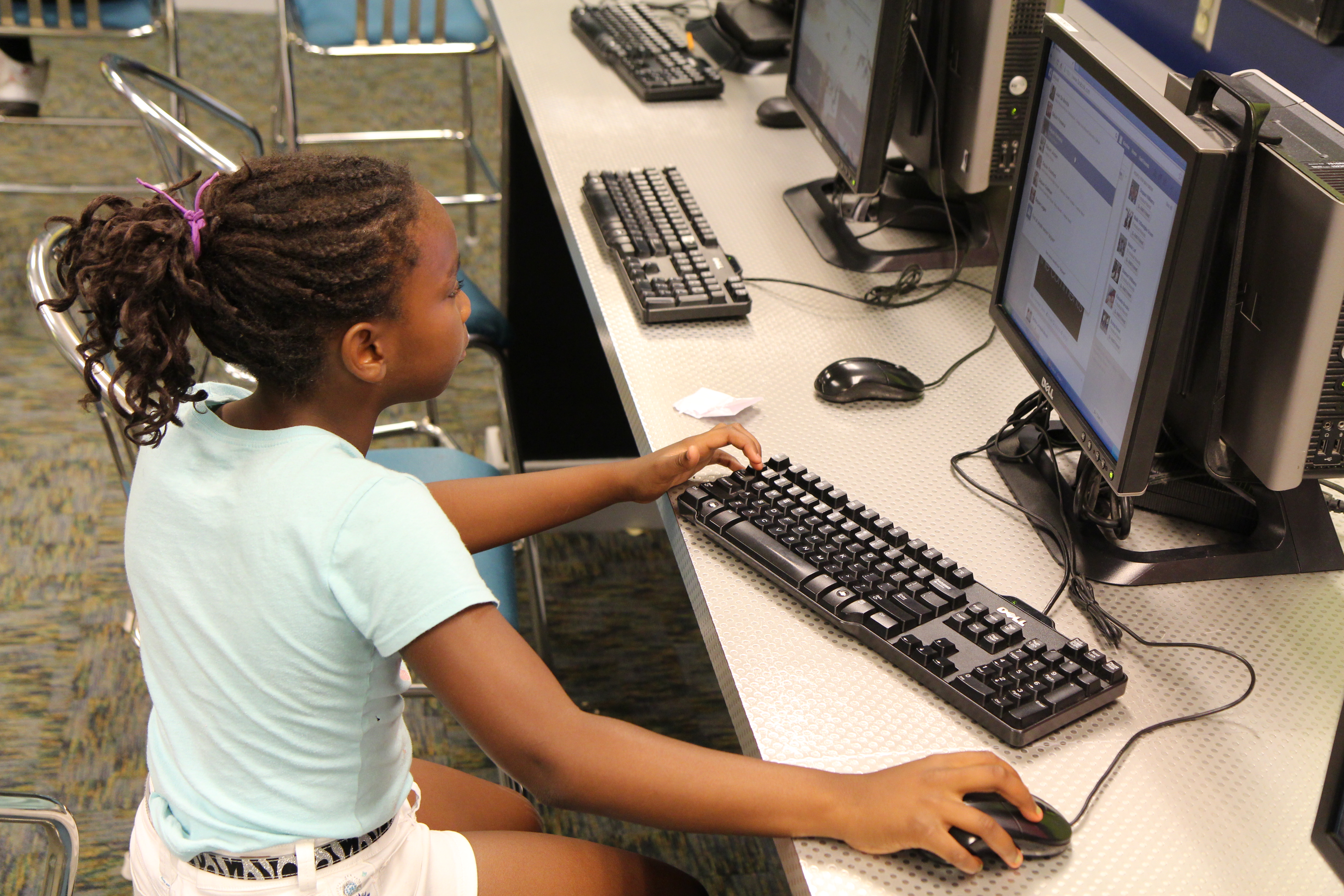 teen girl on a computer