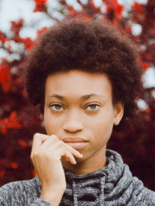 Woman on background of red leaves