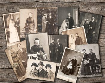 vintage family photos on wooden background