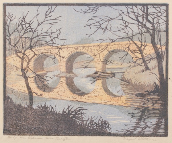 arch bridge with water and trees