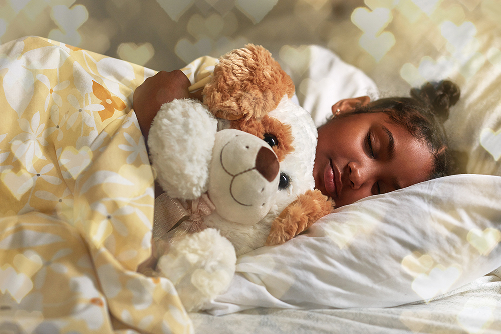 little girl sleeping with stuffed animal