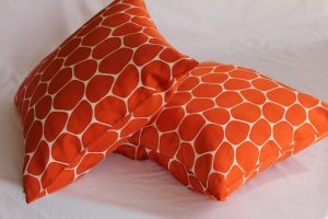orange and white throw pillows