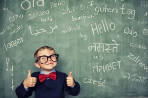 boy thumbs up with hello in many languages