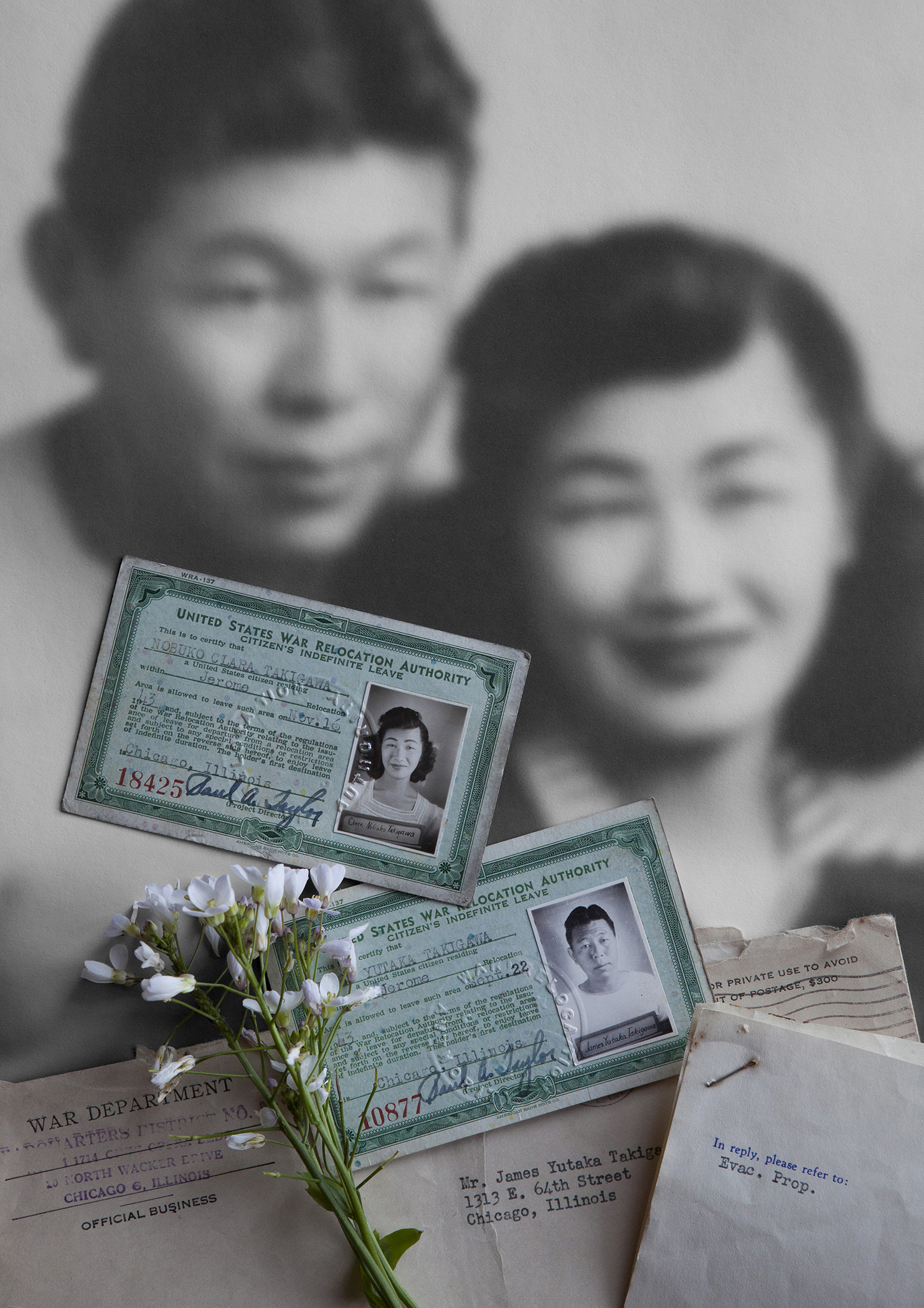 photograph of two people with ID cards 
