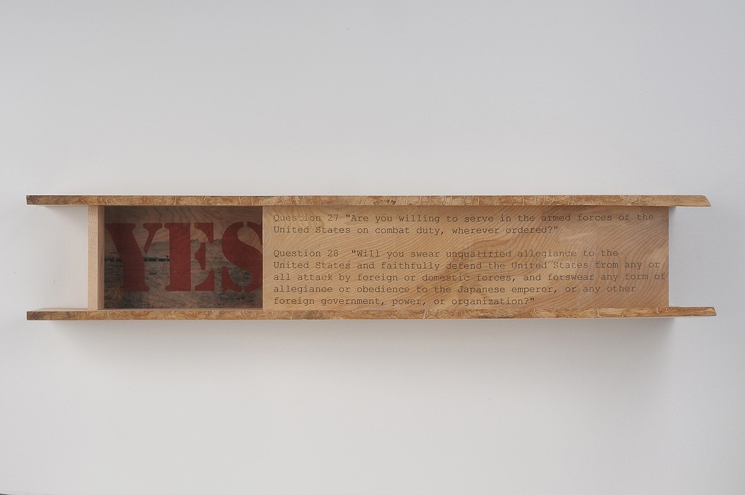 horizontal wood artwork with the word YES in red
