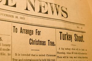 An old edition of a local newspaper dated 1911. The articles are about a community Christmas tree and a turkey shoot.