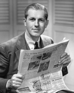 UNITED STATES - CIRCA 1950s: Businessman reading newspaper.