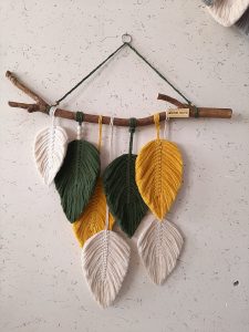 macrame feathers hanging from branch