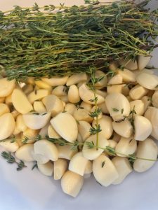 peeled garlic and thyme