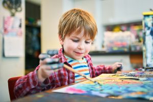 preschool boy painting