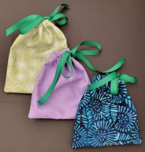 small handsewn bags with ribbon drawstrings